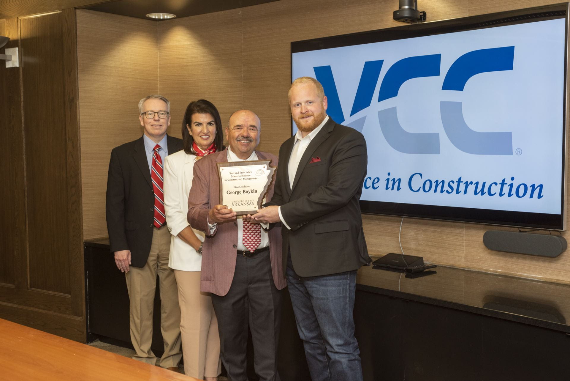 Pictured, from left, are Micah Hale, head of the Department of Civil Engineering, donors Janet and Sam Alley and Master of Science in Construction Management graduate George Boykin.