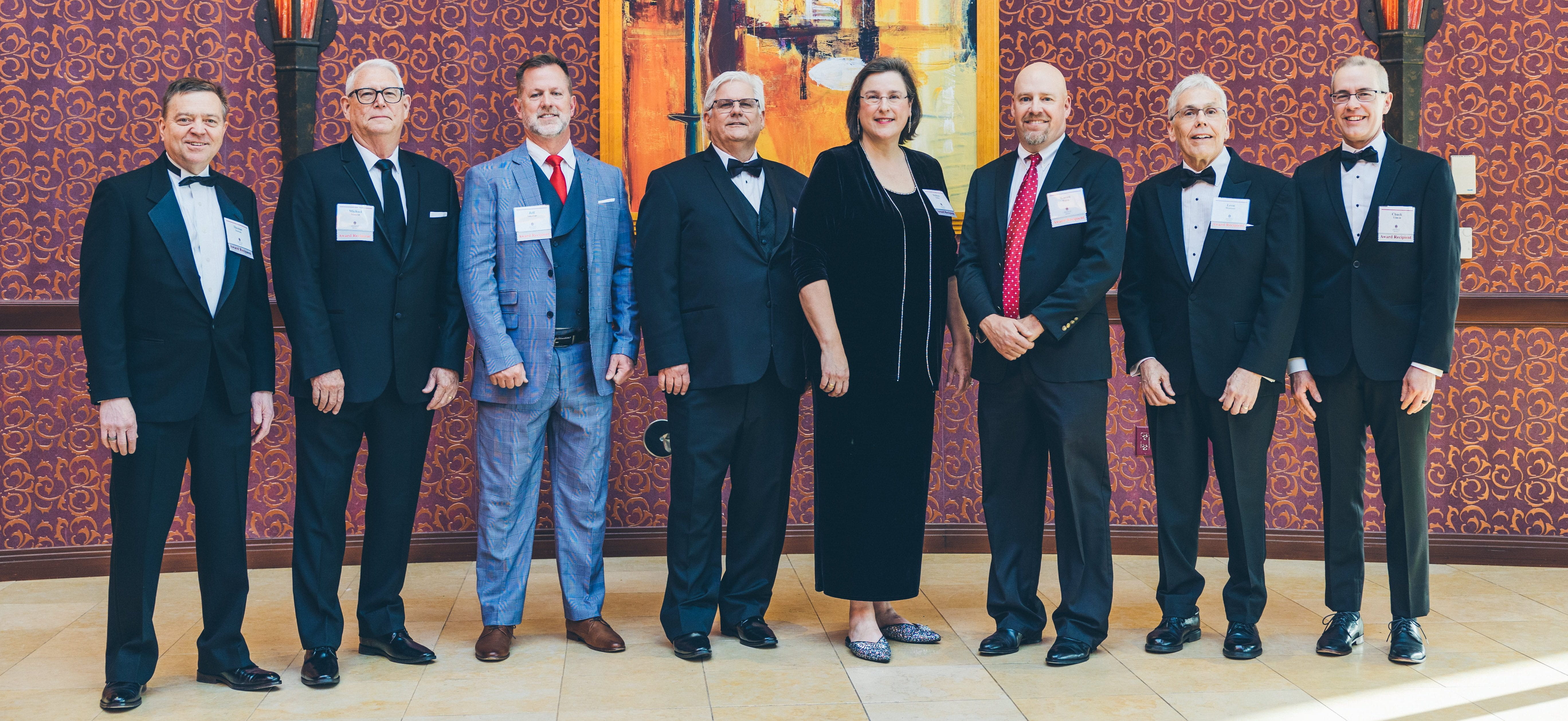 Pictured, left to right, are Distinguished Alumni Award recipients Thomas Newton, Michael Mourot, Jeff Amerine, Brad Jackson, Melissa Summerlin Tooley, Gaven Smith, Leon Wittmer and Chuck Tilmon.