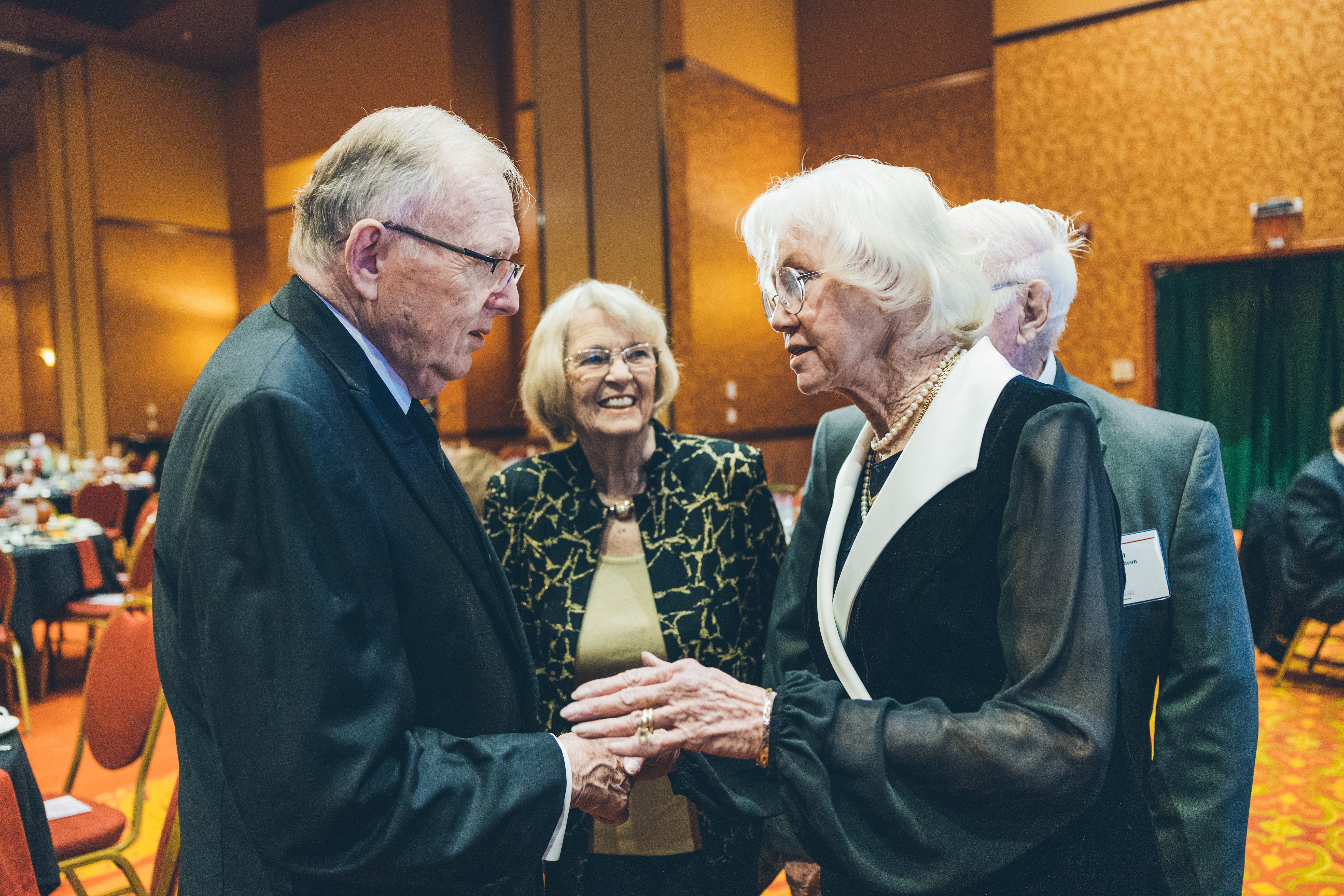 Chancellor Emeritus John A. White and his wife, Mary Lib, greet Hall of Fame inductee L. Lee Johns Lane.